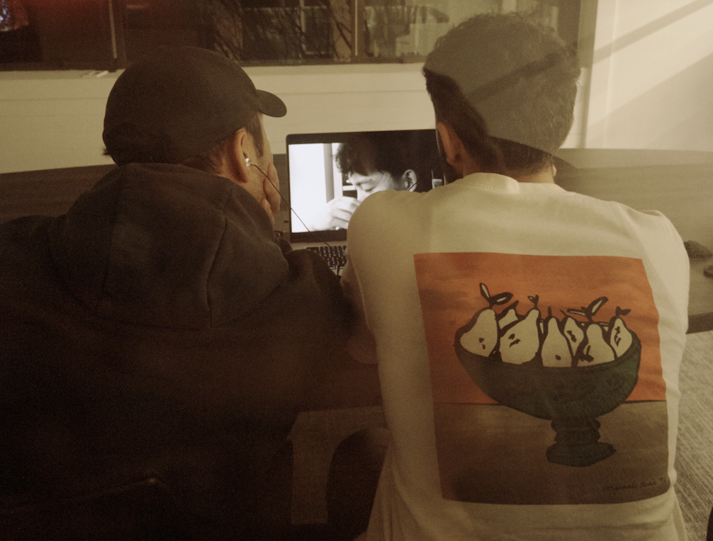 Two founders reviewing work on a laptop at Althra.