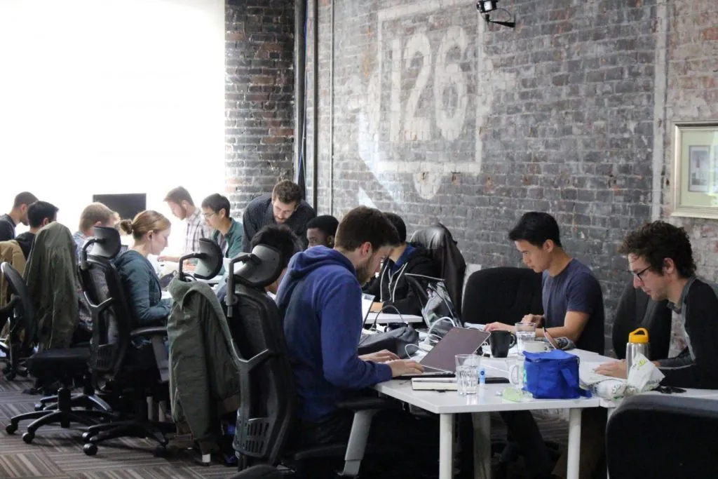 Students working at Lighthouse Labs.